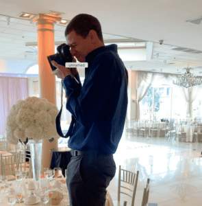 Professional photograper is taking photos of the floral work for florist