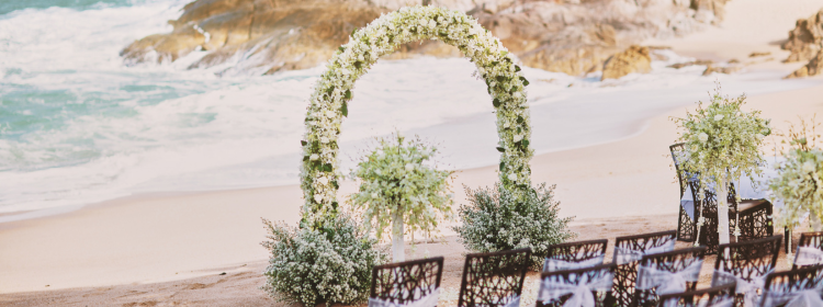 Ceremony Arch and Floral arrangements For Wedding With White Flowers.