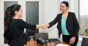 Wedding florist presenting floral proposal during consultation with couple